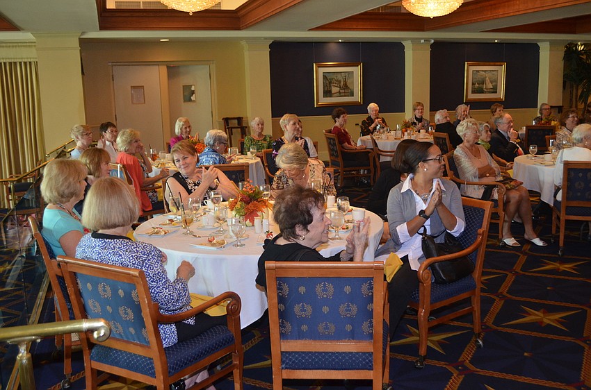 Attendees clap after hearing Webb explain what they can expect from this new season.