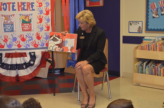 County Commissioner Vanessa Baugh reads "Duck for President."