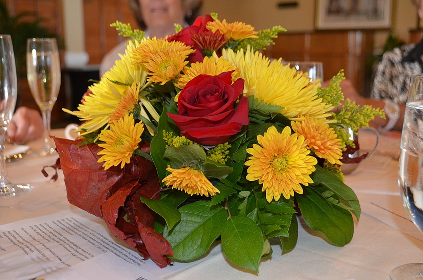 Flower centerpieces rested on the center of each table at the Women’s 18-Hole Golf Association’s opening luncheon.