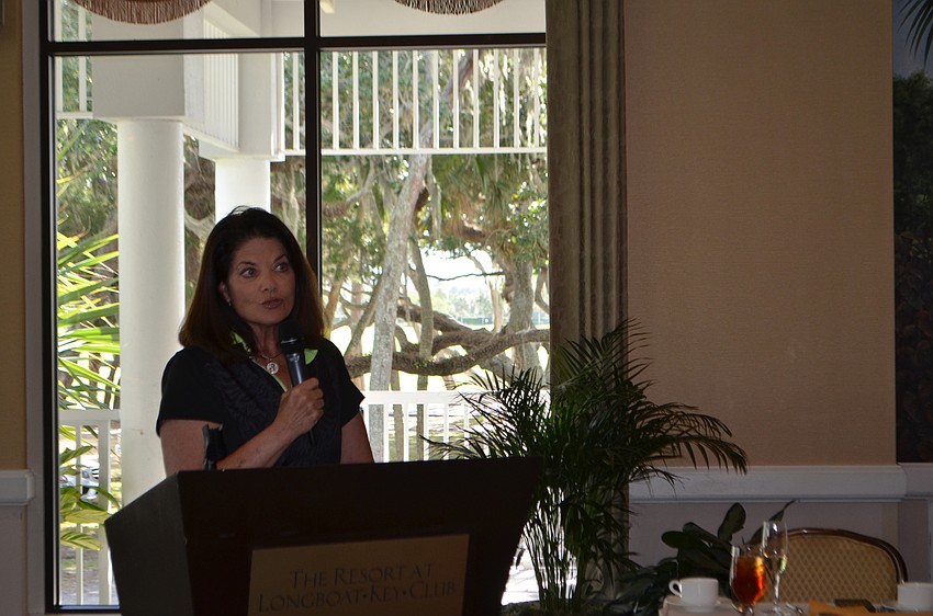 President Suzanne Reiman greets the members during the Women’s 18-Hole Golf Association’s opening luncheon.