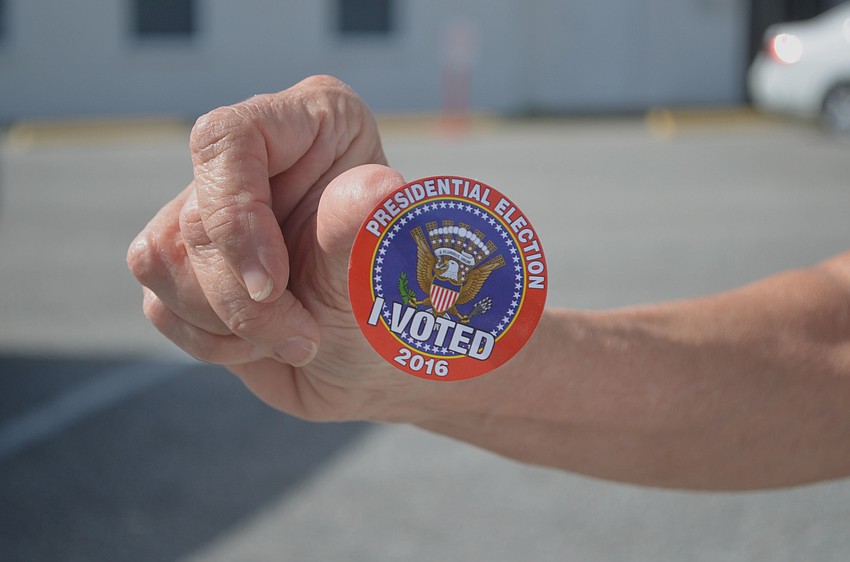 One Sarasota resident shows off her sticker outside Southside Baptist Church. Although she's excited for the election to be over, she doesn't think the campaigns are going to end when the polls close. 