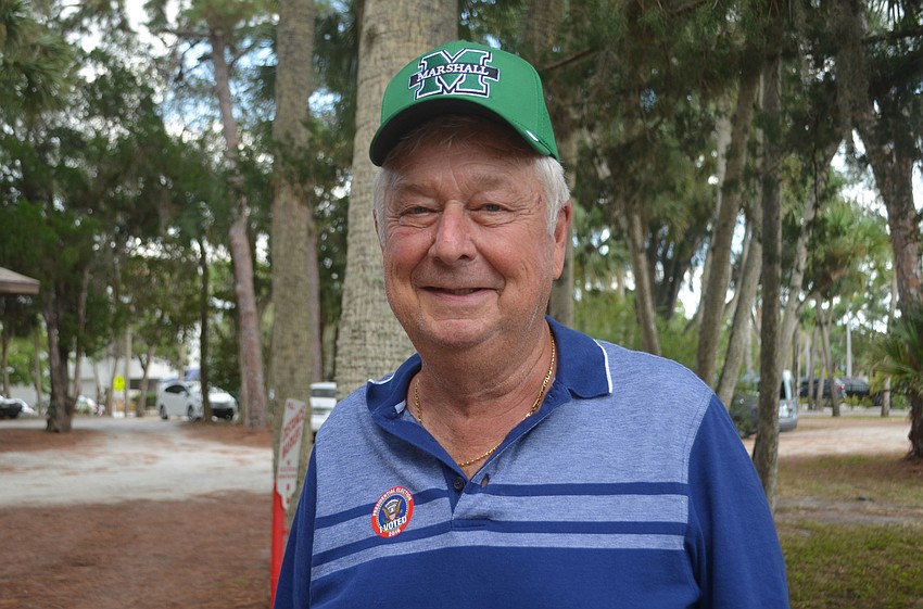 Ben Williams shows off his sticker outside Siesta Key Chapel on Siesta Key.
