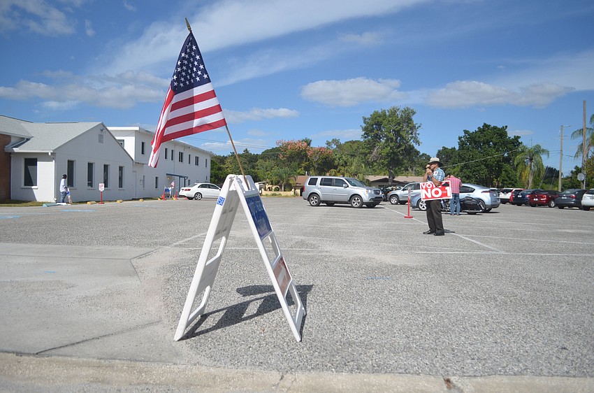 Paul Colin and Bob Johnson campaigned against Amendment  1 outside Southside Baptist Church.