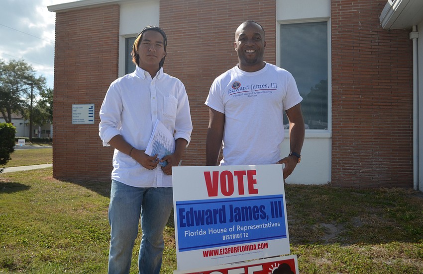 Democratic candidate for the House of Representatives Edward James III brought food and water to campaign volunteer Paul Colin at Southside Baptist Church.