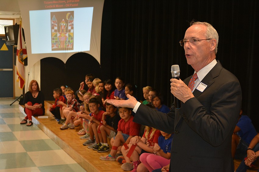 Pat Neal congratulates the students on their effort.