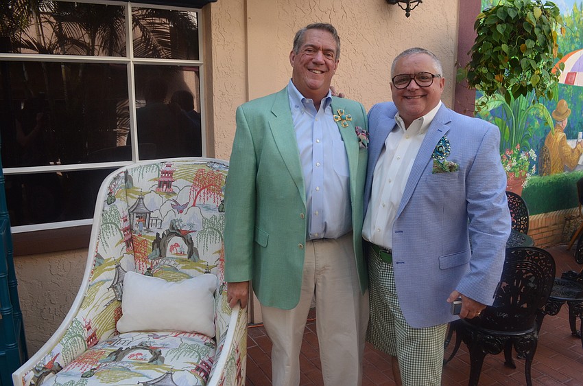 Bill Griffin and Sam June pose next to their display from Norris Furniture & Interiors.