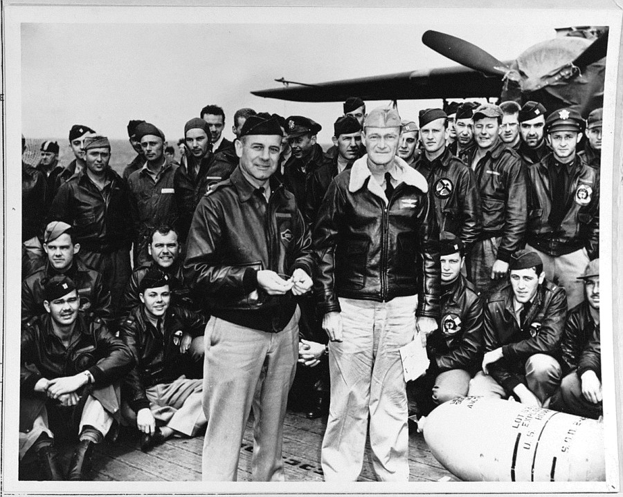 Lt. Col. James Doolittle, left foreground, and Navy Capt. Marc A. Mitscher, skipper of the USS Hornet, gathered the 79 other Raiders for a group photo prior to launching the Raid over Tokyo on April 18, 1942. Courtesy photo