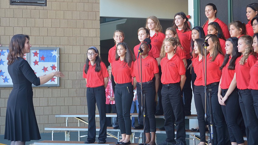 Braden River music teacher Celia Sperotto leads the choir in 