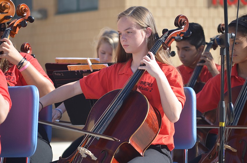 Braden River Middle School eighth-grader Niah Shrock plays the cello at the Veterans Day service.