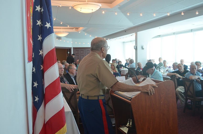 Event organizer and Marine Tom Smith address attendees of the 14th annual Marine Corps Birthday celebration at Marina Jack.