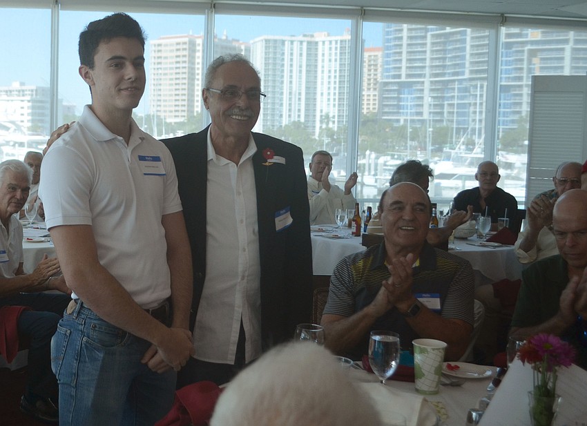 Madison Brillon is acknowledged with his father Robert Brillon. Madison Brillon will be signing up for the Marine Corps in January— 40 years after his father made the some commitment.