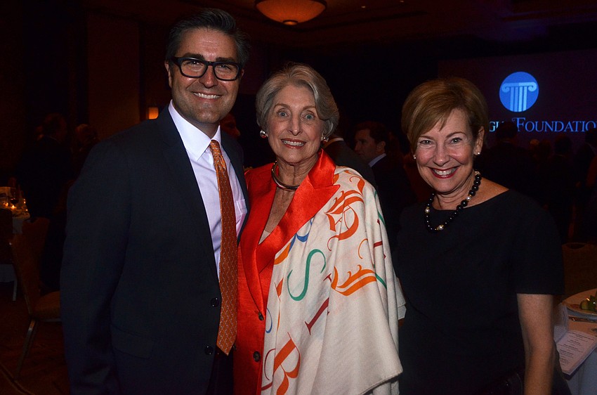 Tom Luzier, Honoree Michael Saunders and Georgina Clamage