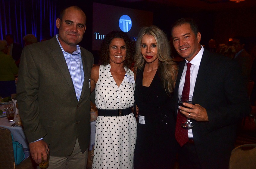 Travis and Elaina Mullet with Kim and Jay Coblentz