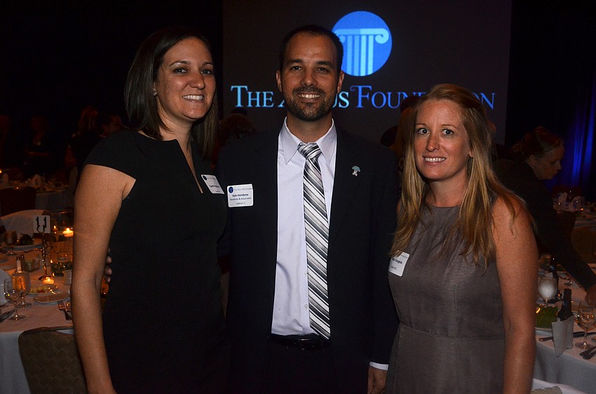 Caprill and Kyle Hembree with Nikki Caragiulo