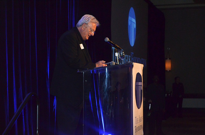 Reverend Donald Roberts leads the opening prayer.