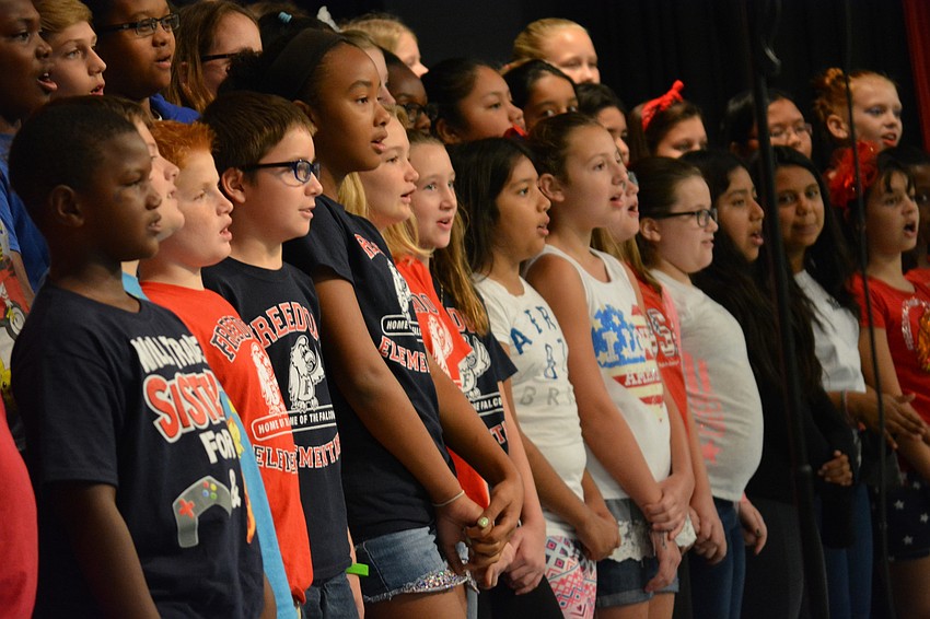 Fifth graders perform a variety of patriotic songs for the crowd.