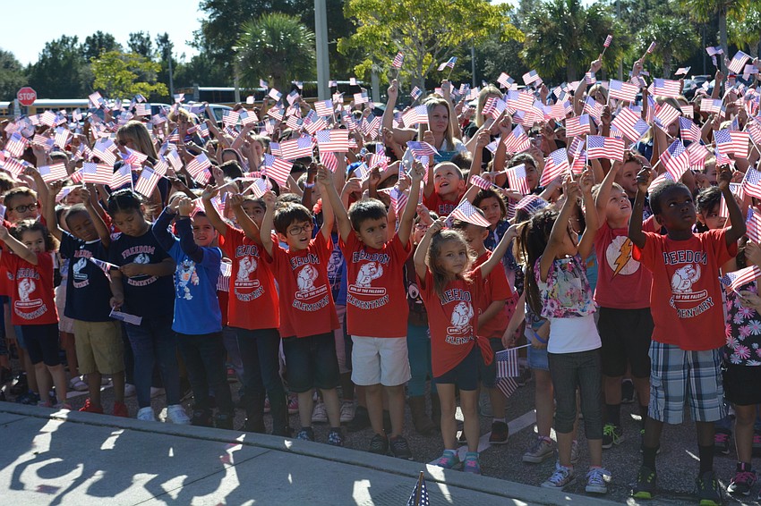 The ceremony concluded with flag waving and a song by all of Freedom's students.