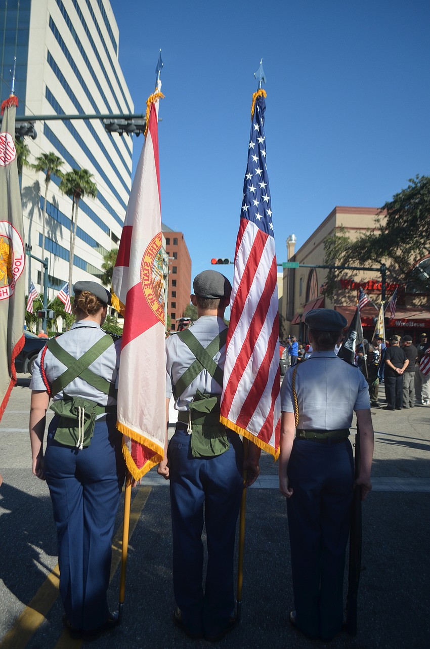 Jazmine Andrews, Max Holahan and Jazmine Andrews stand at attention before the parade began.