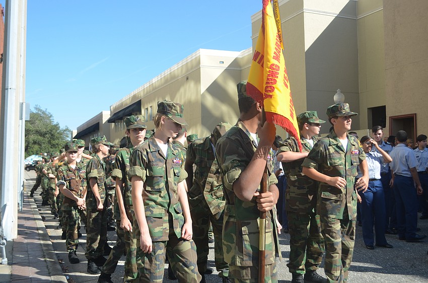 The Venice Middle School Young Marines wait in line on Links Avenue .