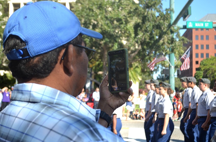 Thomas Williams records the Veterans Day Parade.