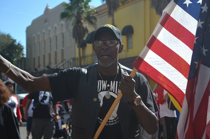Vietnam veteran Anthony Jay led a U.S.A. chant during the Veteran's Day parade. Jay marched for prisoners of war and members of the armed forces who went missing in action.