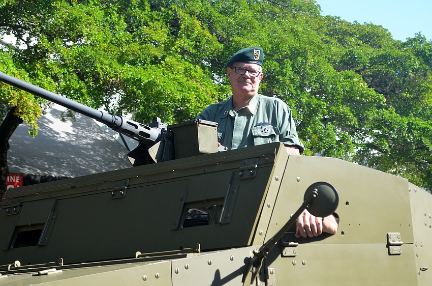 George Laessig stands in a tank during Sarasota's Veteran's Day parade.