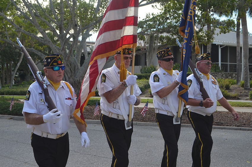 A color guard led the third annual Veterans Day Parade following a Longboat Key Fire Department fire truck.