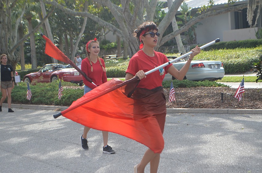Flag twirlers from the Booker High School Marching Band performed during the third annual Longboat Key Veterans Day Parade.