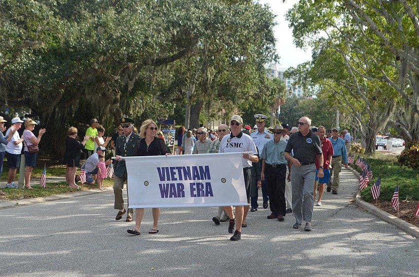 Vietnam War era veterans make their way through the quarter-mile parade route.