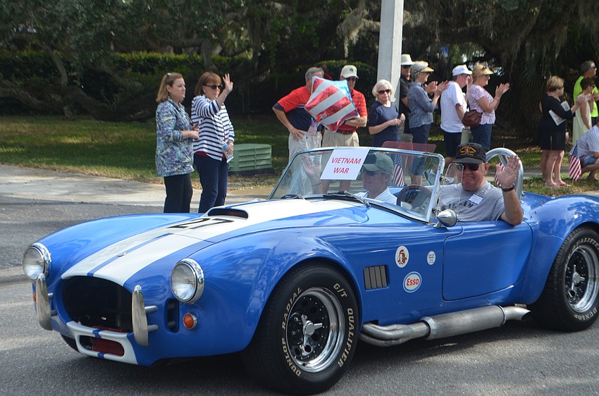 Vietnam War era veterans make their way through the quarter-mile parade route.