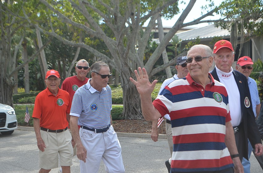 Veterans wave to family, friends and bystanders during Longboat Key’s third annual Veterans Day Parade.