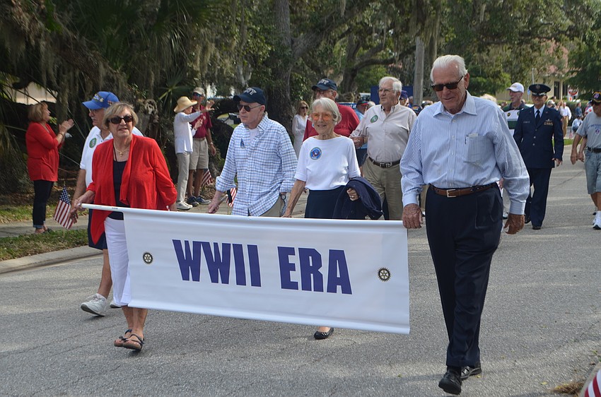 World War II veterans make their way through the quarter-mile parade route.