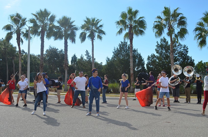 Booker High School Marching Band, The Whirlwind Brigade, and performers entertained the crowd at the end of the parade.