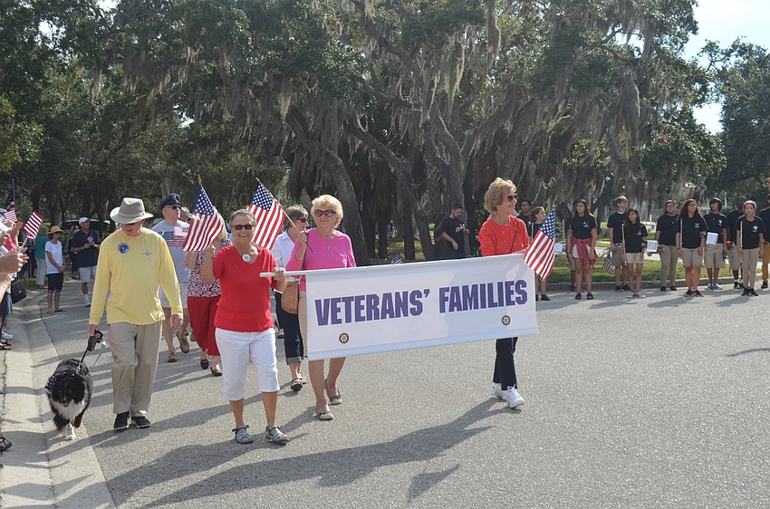 Veterans’ families finished the parade while waving to friends. About 150 veterans participated in this year’s event.