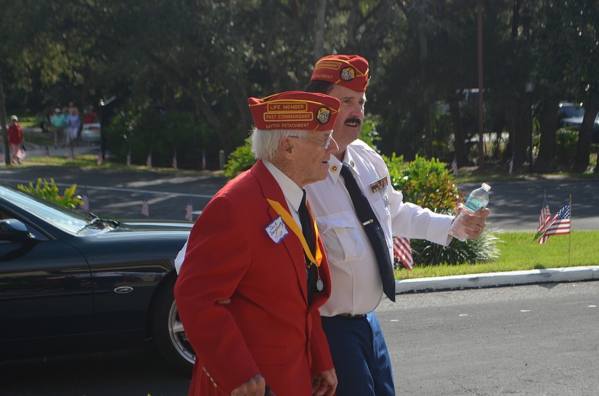 Jack Daugherty and David Tyler Morgan make their way from the parade to the honor program on Nov. 11.