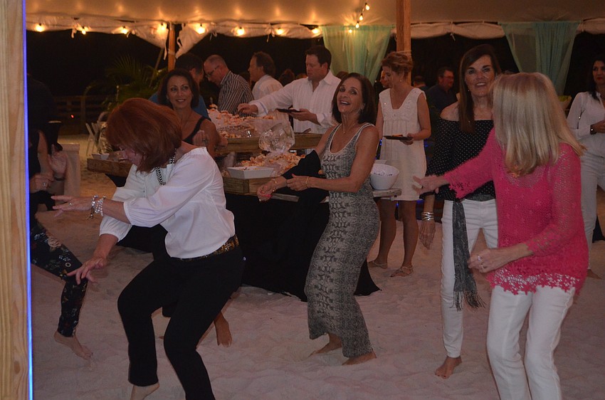 Bacchus on the Beach attendees tear up the dance floor after filling up on stone crab.