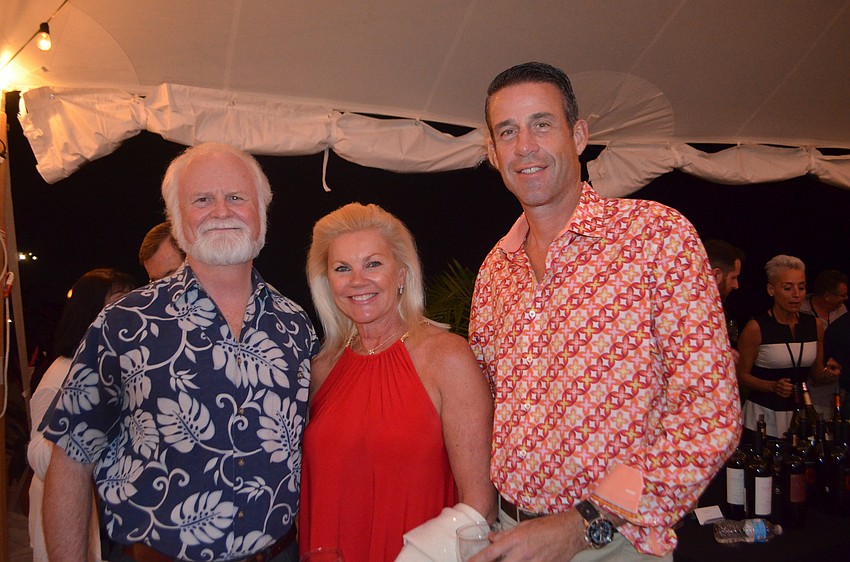 President and CEO of Mote, Michael Crosby and Karen and John Arnold