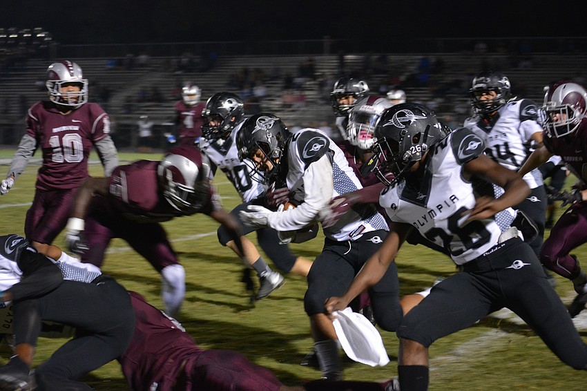 A Riverview defender prepares to lay the boom on an Olympia ballcarrier. The Rams beat the Titans 56-25.