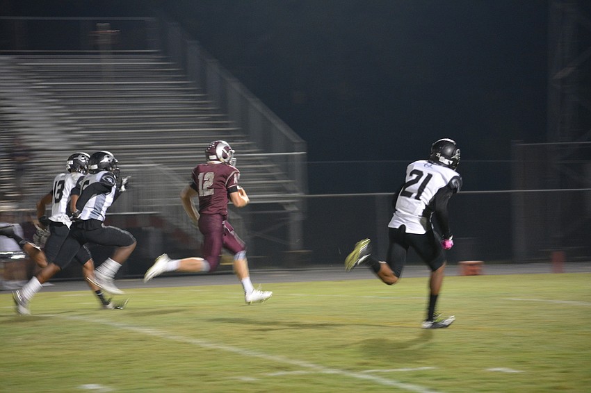 Riverview quarterback Mike Welcer scampers for a touchdown in the third quarter of the Rams' 56-25 home win over Olympia on Nov. 11.