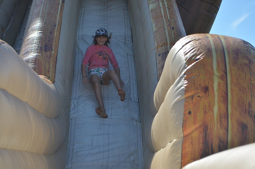 Lakewood Ranch's Gabriele Bucinskas, 11, tries out the inflatable slide at Festa Italiana.
