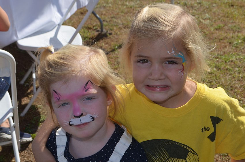 River Club's Emmy O'Hara, 2, and her sister Lily O'Hara, 4, obviously enjoyed having their faces painted.