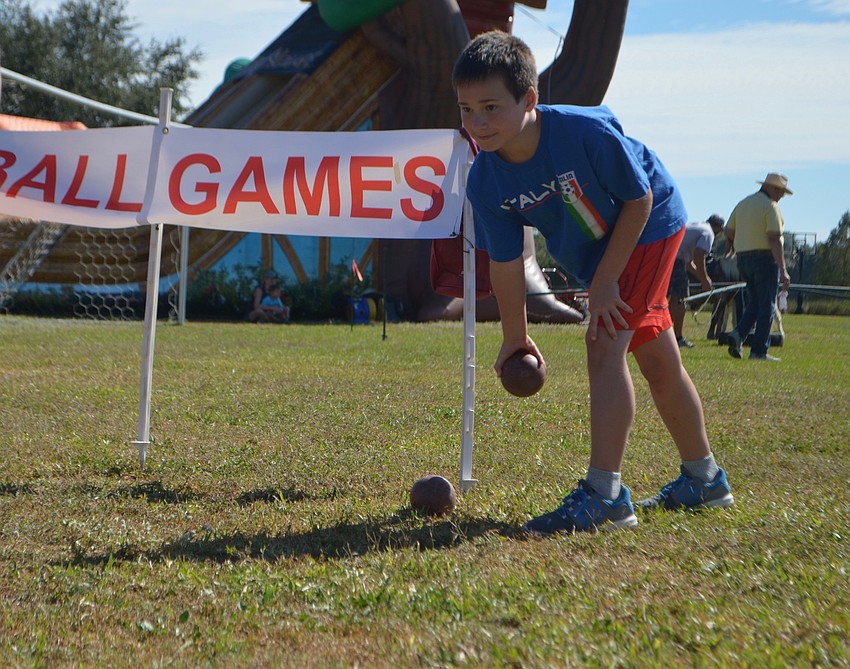 Lakewood Ranch's Nate Bentze, 10, plays his first round of Bocce Ball at Festa Italiana.