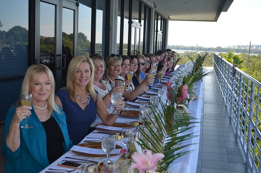 Guests raise their glasses before beginning brunch.