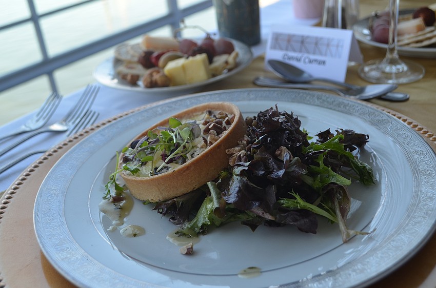 Wild mushroom quiche tartlet with organic mixed greens, sherry vinaigrette, shaved Parmigiano Reggiano and candied pecans was the first course of the three-course brunch.