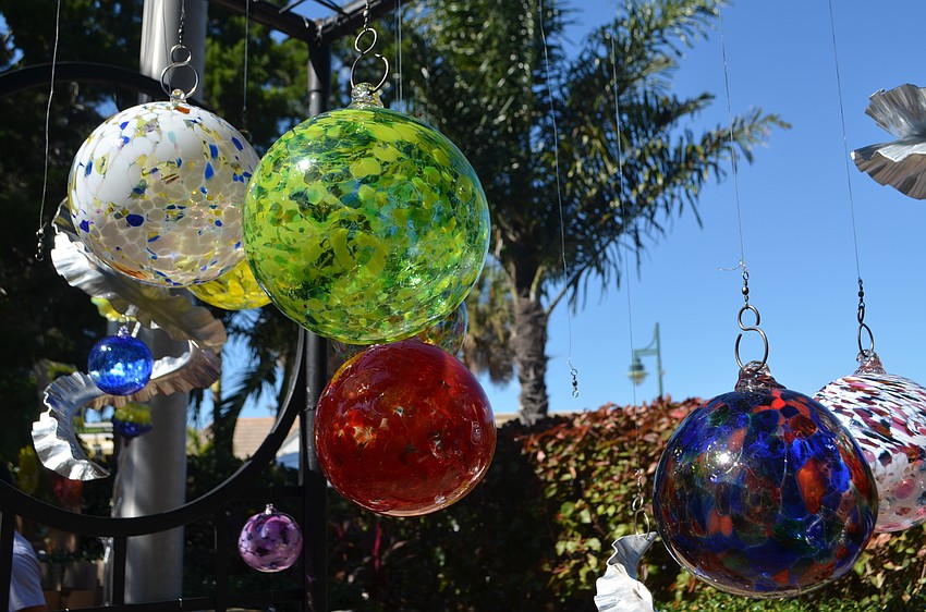 Glass artwork from Somewhere Glassworks swayed in the wind during the St. Armands Art Festival.
