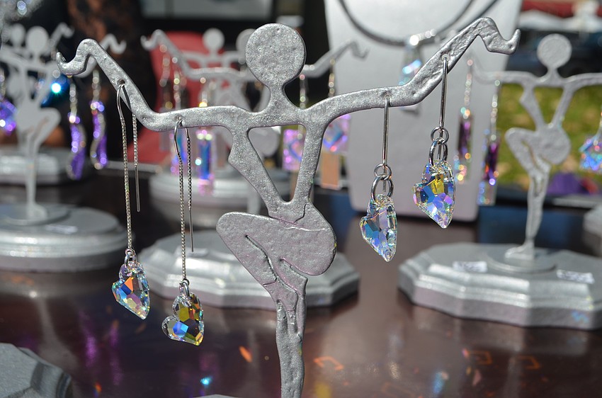 Earrings from Christine/David Goshom Jewelry sparkled in the sunlight during the St. Armands Art Festival.
