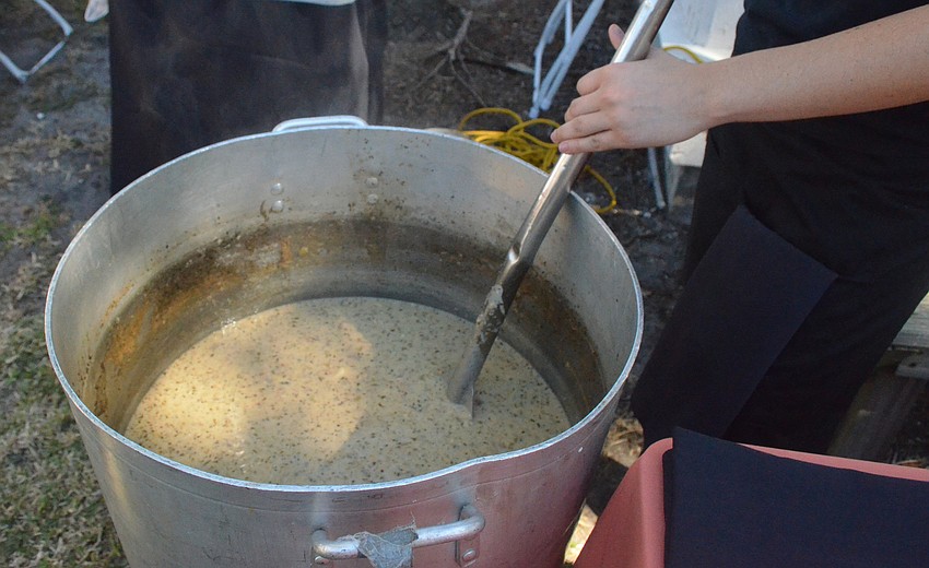 Michael’s On East server Liliana Martin serves clam chowder.