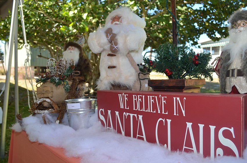 Three Santa Claus figures, a holiday lamppost and an “I Believe in Santa” sign make up the Christmas-themed auction item, valued at $350.