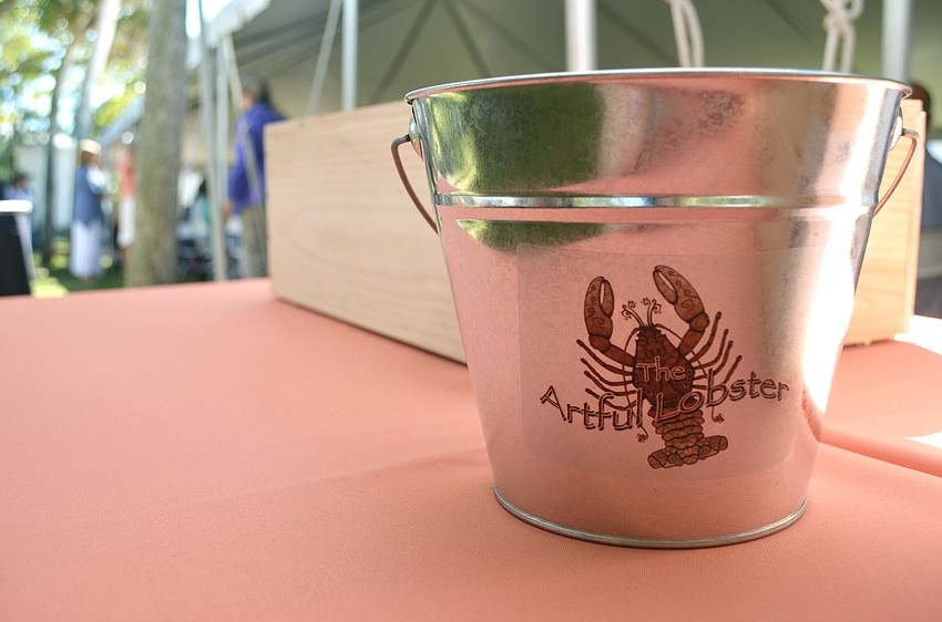 Raffle tickets were placed in Artful Lobster-themed buckets.