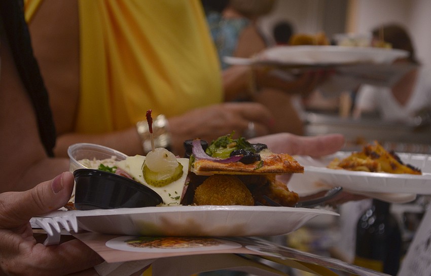 Plates were piled high as eventgoers sampled food from 20 different restaurants.